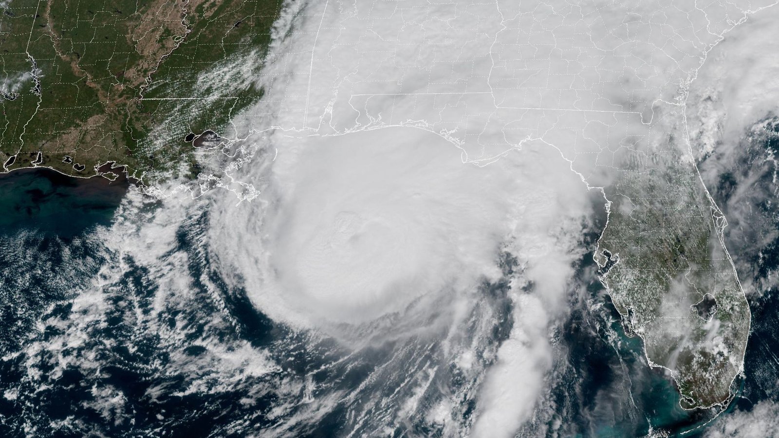 ‘The storm is here – buckle down’: Hurricane Isaias makes landfall in US